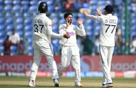 India's Kuldeep Yadav (centre) celebrates after taking the wicket of the West Indies' Justin Greaves