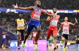 Noah Lyles (C) anchored the USA 4x100 metre relay team to gold at the World Athletics Championships in Tokyo