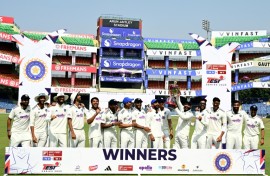 India's players celebrate with the trophy after their win against West Indies