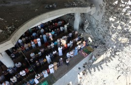 Palestinian Muslims took part in Friday prayers this week despite many of their mosques being redcued to rubble