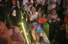Catholics gather at La Candelaria Square to attend the canonization ceremony of Venezuelan doctor Jose Gregorio Hernandez and Venezuelan Sister Maria Rendiles in Caracas