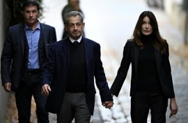 Sarkozy walked out of his home hand-in-hand with his wife singer Carla Bruni