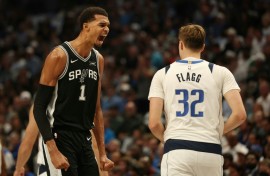 Victor Wembanyama (L) is officially listed this season at 7 feet 4 inches -- about 2.24 meters -- making him the tallest player in the league, tied with Memphis center Zach Edey