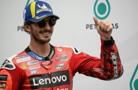 Italian MotoGP rider Francesco Bagnaia celebrates coming first in qualifying