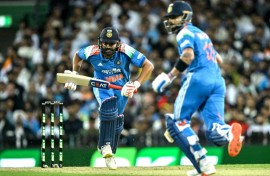 India's Rohit Sharma (L) and Virat Kohli run between the wicket during the third one-day international against Australia