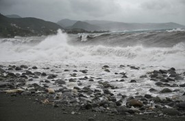 Waves crash onto the beach in Kingston on October 27, 2025; Hurricane Melissa threatened Jamaica with potentially deadly rains after rapidly intensifying into a top-level Category 5 storm