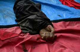 The hand of a dead man is seen among a line of bodies on Sao Lucas Square of the Vila Cruzeiro favela at the Penha complex in Rio de Janeiro, Brazil, on October 29, 2025, in the aftermath of Operacao Contencao (Operation Containment). Residents of a favela in Rio de Janeiro lined up more than 50 bodies at a plaza in their low-income neighborhood on Ocotber 29, a day after the bloodiest police operation in the city's history, AFP reported.