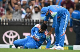 India’s Shreyas Iyer (L) lacerated his spleen taking a catch against Australia