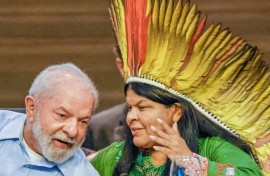 Brazilian President Luiz Inacio Lula da Silva (L) and his Minister of Indigenous Peoples, Sonia Guajajara, chat during a meeting in Belem