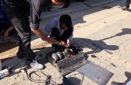 Engineering students prepare their robot for a battle event at Iran's Tech Olympics