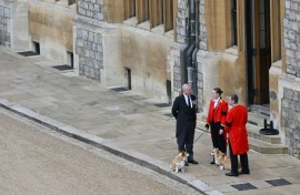 Andrew stands with the corgis, Muick and Sandy, inside Windsor just after the queen's death