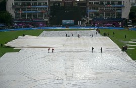 Raincovers on the pitch before the start of the Women's World Cup final