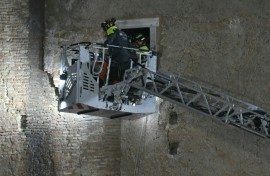 Rescuers worked to evacuate a worker who was trapped in the medieval tower Torre dei Conti after the tower partially collapsed in the historic center of Rome