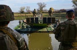 In the drill, a multinational brigade is conducting maneuvers and live-fire artillery and tank exercises, together with Romanian troops