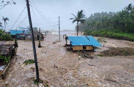 Houses in the Philippines Catanduanes province were swamped by surging floodwaters from Typhoon Fung-wong