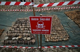 Thailand has suspended the implementation of a peace agreement with neighbouring Cambodia after a landmine blast injured two Thai soldiers near the border