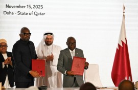 Officials from the rival DR Congo government and the Rwanda-backed M23 movement stand with a Qatari negotiator at the signing of a new roadmap seeking to establish a permanent peace in devastated eastern DRC