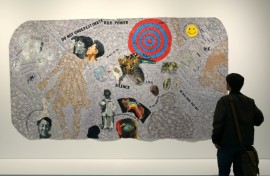 A person looks at a piece by US artist Howardena Pindell entitled 'Autobiography: Scapegoat' at the Studio Museum in Harlem in New York