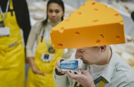 Kuba Maziarczyk sniffs a piece of cheese
