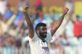 India's Jasprit Bumrah celebrates after taking five-wicket haul during the first day of the first Test cricket match against South Africa at the Eden Gardens in Kolkata