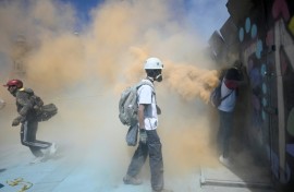 Police protecting the compound used tear gas grenades and fire extinguishers to contain the protesters