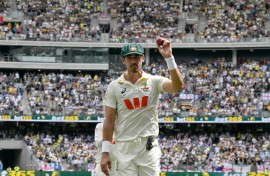 Australia's Mitchell Starc celebrates took seven wickets in the first Ashes Test