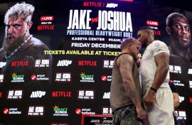 Jake Paul (left) and Anthony Joshua (right) face off at a press conference ahead of their Netflix-backed heavyweight fight next month