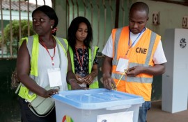A National Electoral Commission official seals a ballot box before polls open