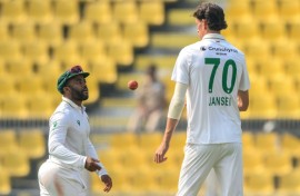 South Africa's captain Temba Bavuma (left) speaks with pace bowler Marco Jansen