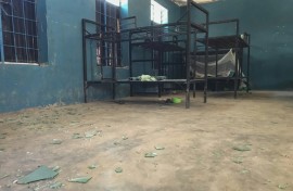 Empty bunk beds, shattered glass and scattered belongings are all that remain in this student dormitory at the school