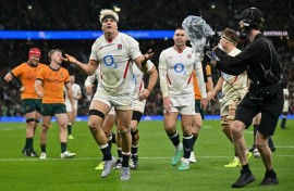 England's Henry Pollock (C) celebrates after scoring a try against Australia at Twickenham
