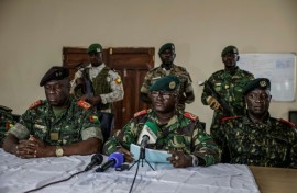 Brigadier General Denis N'Canha (C), head of the military office of the presidency, gave a press conference announcing the takeover