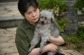 Fifteen-year-old poodle Jason was rescued by firefighters from the Wang Fuk Court blaze and reunited with owner Jacky Lee
