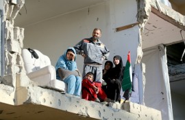 But the backdrop told a different story: dilapidated buildings, piles of concrete and rubble, the scars of two years of conflict in Gaza