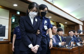 South Korea's former first lady Kim Keon Hee (L) was arrested in August and is under investigation over an alleged stock manipulation scheme and for accepting gifts from the Unification Church