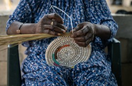 Senegalese-style baskets consist of coiled reeds wound together with colourful plastic strips, which in the olden days would have been palm fibres