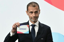 UEFA president Aleksander Ceferin shows the name of Germany, selected as women's 2029 Euros hosts