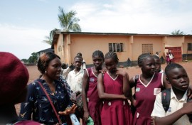 Sexual health activist Fatou Esther Jusu interacts with school girls at a secondary school in Freetown in October 2025