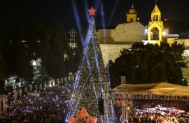 People packed the square in Bethlehem to watch the tree lit up during a two-hour ceremony, metres away from the Church of the Nativity