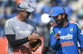 India's captain KL Rahul speaks with bowling coach Morne Morkel after winning the toss