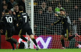 Manchester United's Bruno Fernandes (R) celebrates scoring against Wolves