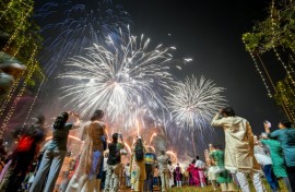 People watch fireworks light up the sky as part of Diwali celebrations in Mumbai in October