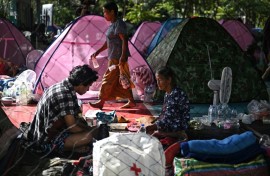 Displaced residents rest at an evacuation center in the Thai border province of Surin during clashes along the Thai-Cambodia border
