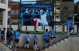 Young footballers head for the pitch at the Mohamed Salah sports complex in Nagrig