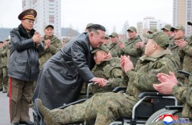 A picture released from North Korea's official Korean Central News Agency (KCNA) showing North Korean leader Kim Jong Un welcoming soldiers