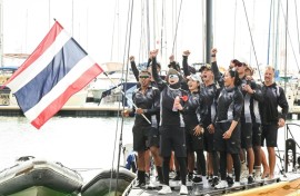 This pool photo taken and released on December 18, 2025 shows Thailand's Queen Suthida (C) celebrating with her team