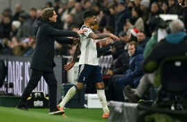 Tottenham captain Cristian Romero is ushered off the pitch by head coach Thomas Frank after being sent off in a 2-1 Premier League defeat by Liverpool