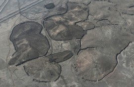 Between the cities of Nasiriyah and Samawah, not far from ancient Sumerian ruins, labourers are working hard to stabilise the soil by applying a layer of moist clay
