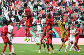 Sudan players (in red) in action against Algeria at the Africa Cup of Nations in Morocco