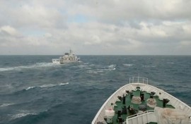 A Taiwan coastguard vessel (R) responds to a China Coast Guard ship (L) during Chinese military drills around Taiwan